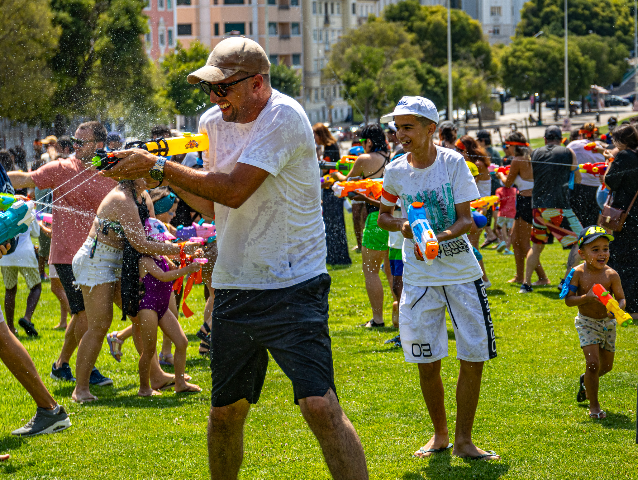 Man in white shirt shooting his water gun